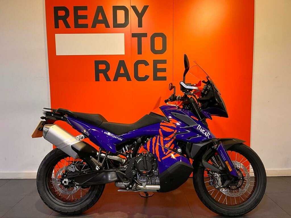 Chester KTM 890 Adventure Dakar Edition — white, blue and orange rally-rep livery, heavy hand guards, one-piece seat